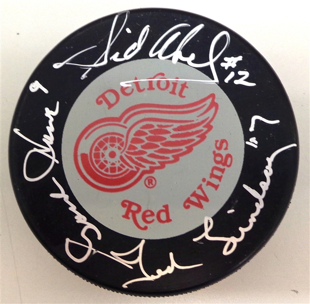 Production Line Autographed Red Wings Puck (Howe Lindsay Abel)