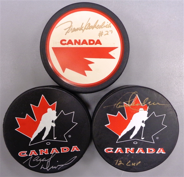 Mahovlich/Dionne/Henderson Autographed Team Canada Puck Lot