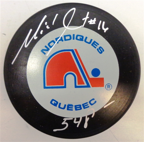 Michel Goulet Autographed Nordiques Puck w/ 548