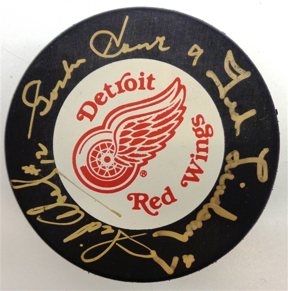 Production Line Autographed Red Wings Puck - Howe/Abel/Lindsay