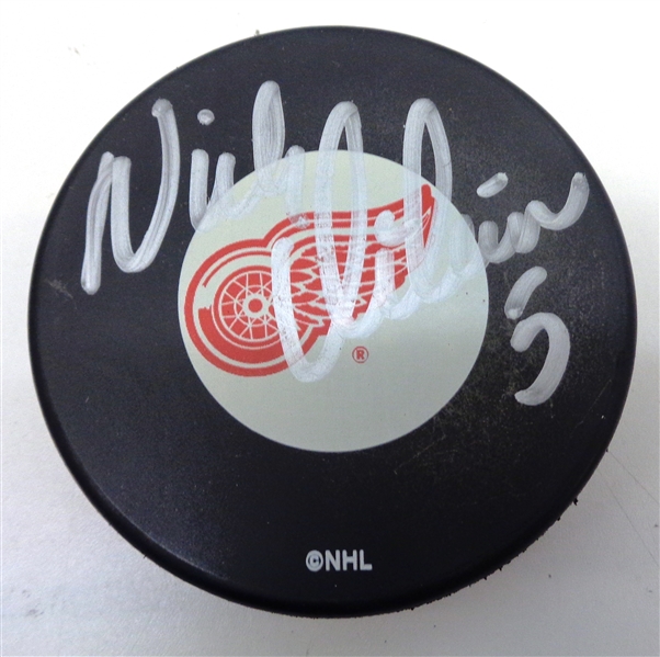 Nick Lidstrom Autographed Red Wings Puck