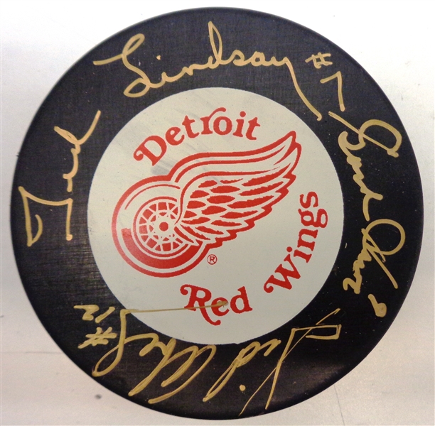 Production Line Autographed Red Wings Puck - Howe/Abel/Lindsay