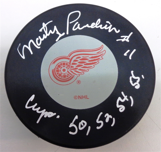 Marty Pavelich Autographed Red Wings Puck w/ Cup Years