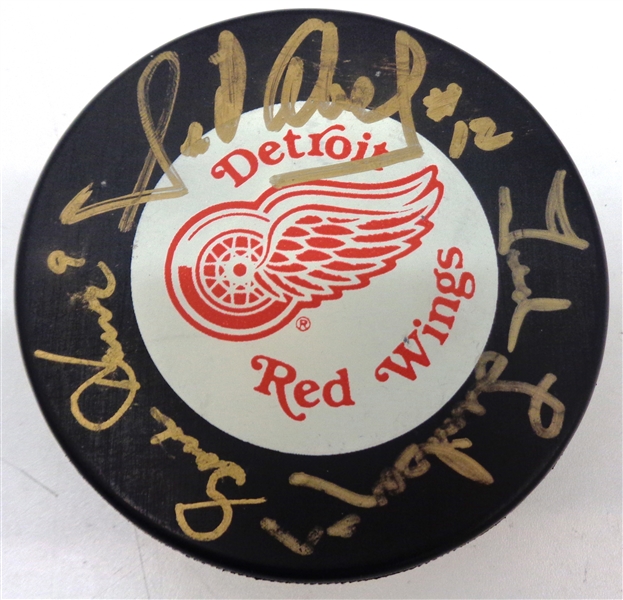 Production Line Autographed Red Wings Puck - Howe/Abel/Lindsay