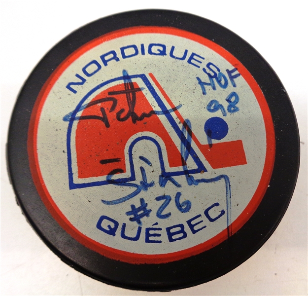 Peter Stastny Autographed Nordiques Puck w/ HOF