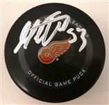 Moritz Seider Autographed Red Wings Puck