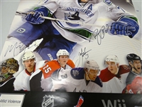 NHL 2K11 Poster Signed by Marty Turco, Jack Johnson and Ryan Kesler