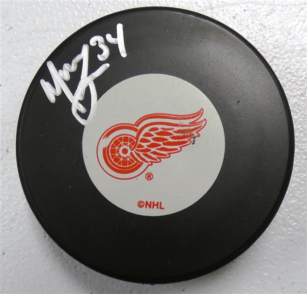 Manny Legace Autographed Red Wings Puck