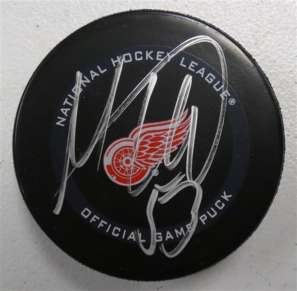 Moritz Seider Autographed Red Wings Puck