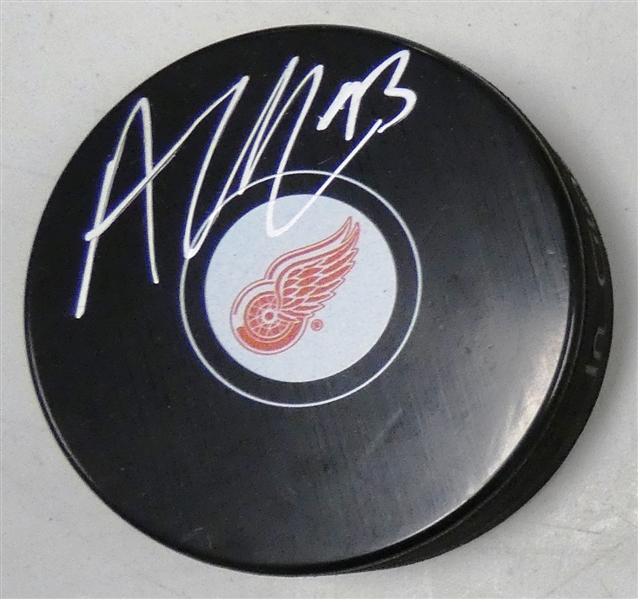 Alex DeBrincat Autographed Red Wings Puck