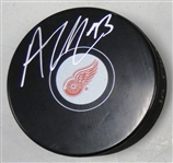 Alex DeBrincat Autographed Red Wings Puck