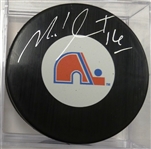 Michel Goulet Autographed Nordiques Puck