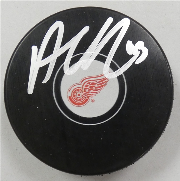 Alex DeBrincat Autographed Red Wings Puck