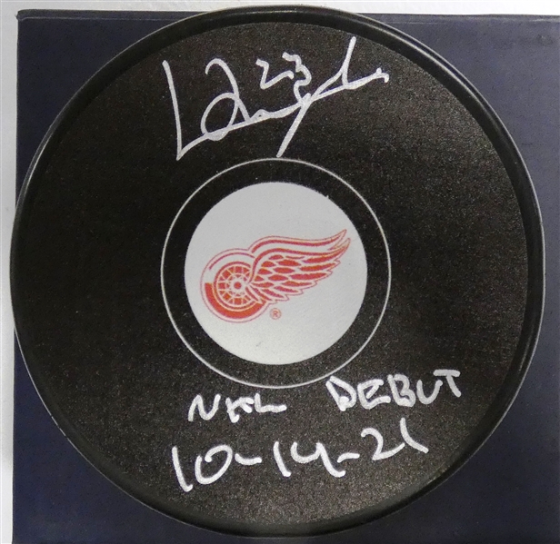 Lucas Raymond Autographed Red Wings Puck w/ NHL Debut