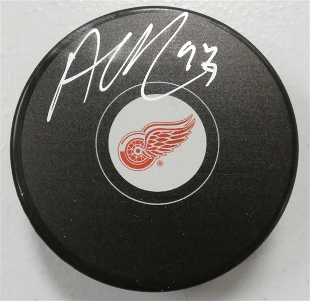 Alex DeBrincat Autographed Red Wings Puck
