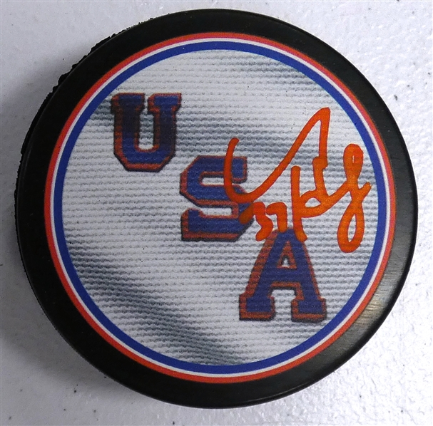 Connor Hellebuyck Autographed USA Puck