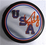 Connor Hellebuyck Autographed USA Puck