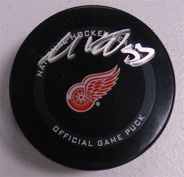 Moritz Seider Autographed Red Wings Puck