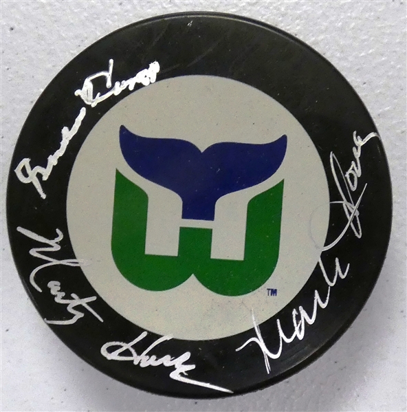 Howe Family Autographed Whalers Puck (Gordie, Mark, Marty)