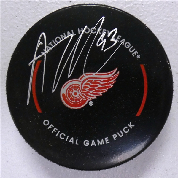 Alex DeBrincat Autographed Red Wings Puck