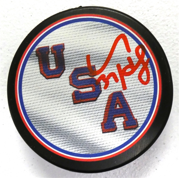Connor Hellebuyck Autographed USA Puck