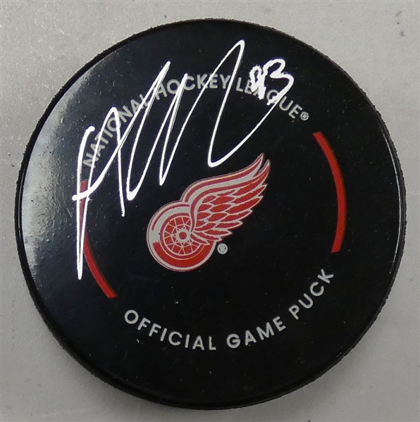 Alex DeBrincat Autographed Red Wings Puck